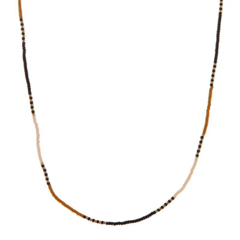 Gold, White, Dark Yellow, and Black Beaded Necklace sold by Anna Beck