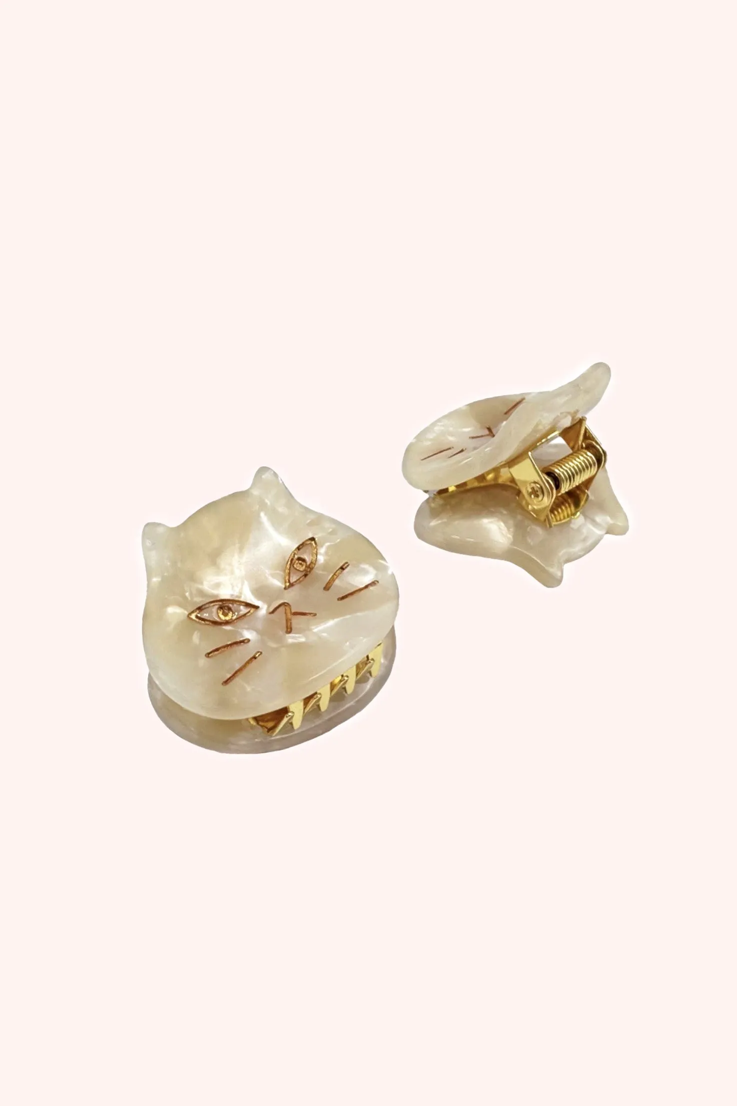 The Cat's Meow Jaw Clip Pair Ivory sold by Anna Sui