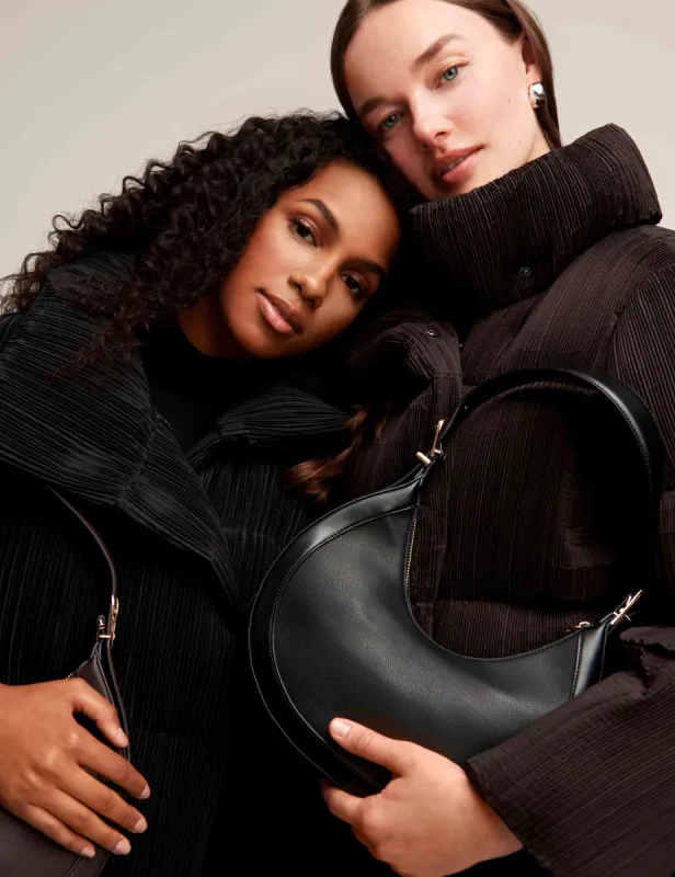 Sculpted Buckle Crescent Shoulder Bag sold by Anne Klein