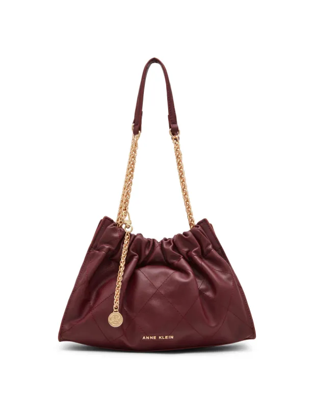 Quilted stitched Cinched closure satchel sold by Anne Klein