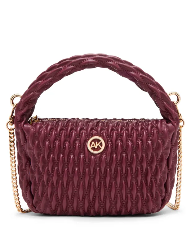 Rounded mini ruched crossbody sold by Anne Klein