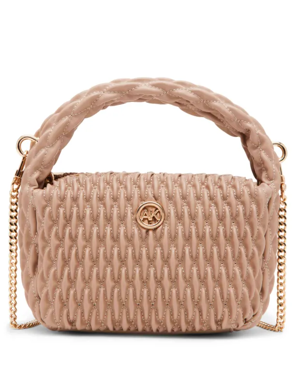 Rounded mini ruched crossbody sold by Anne Klein