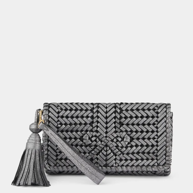 Neeson Tassel Clutch sold by Anya Hindmarch
