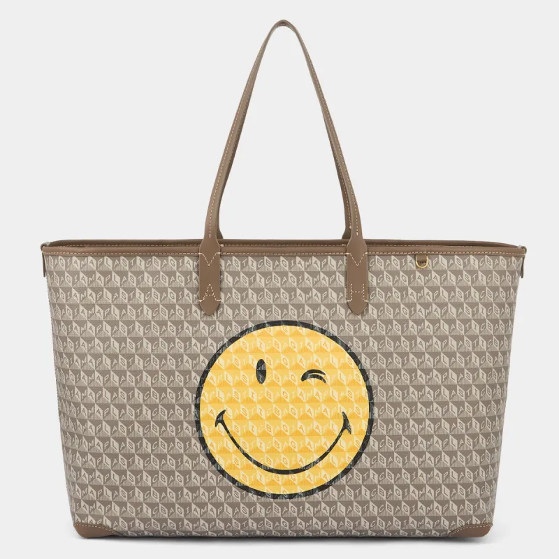 I Am A Plastic Bag Wink Zipped Tote sold by Anya Hindmarch