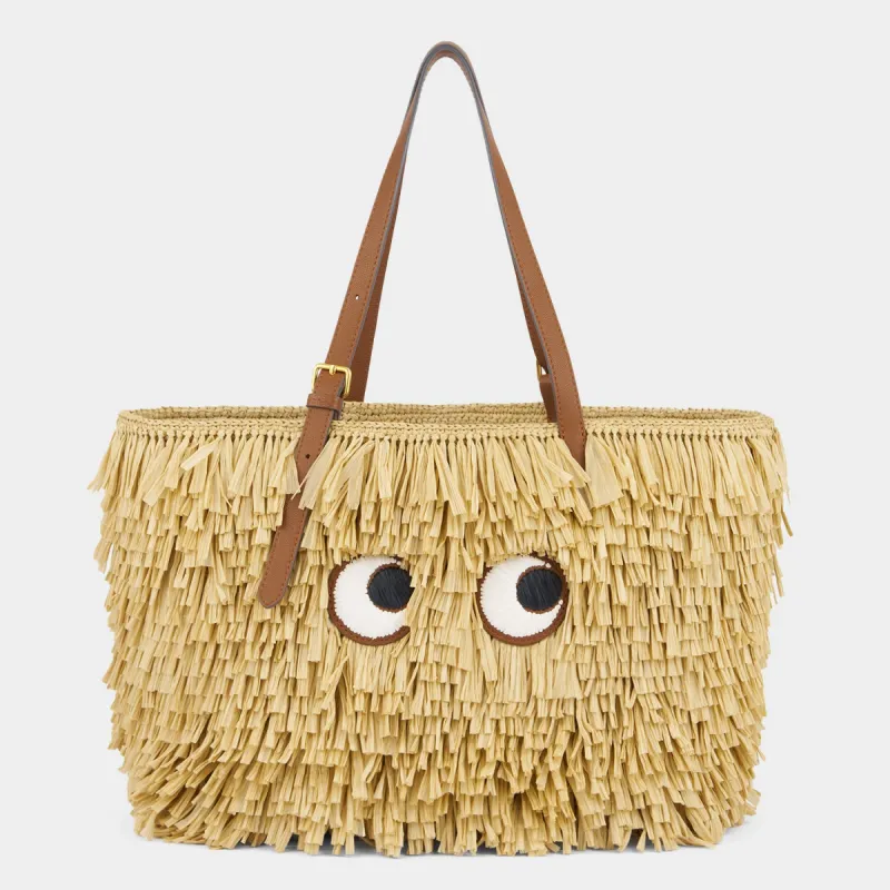 E/W Shag Raffia Eyes Tote sold by Anya Hindmarch