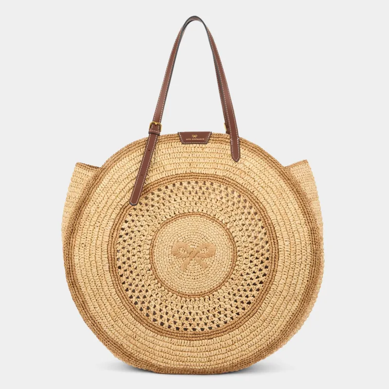 Raffia Round Bow Tote sold by Anya Hindmarch
