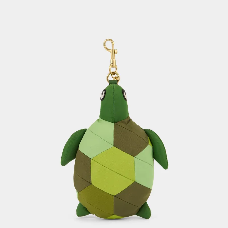 Turtle Charm & Shopper sold by Anya Hindmarch