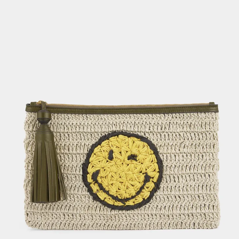 Raffia Wink Pochette sold by Anya Hindmarch