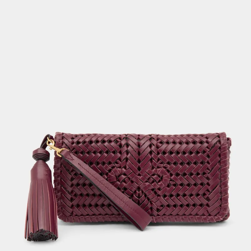 Neeson Tassel Clutch sold by Anya Hindmarch