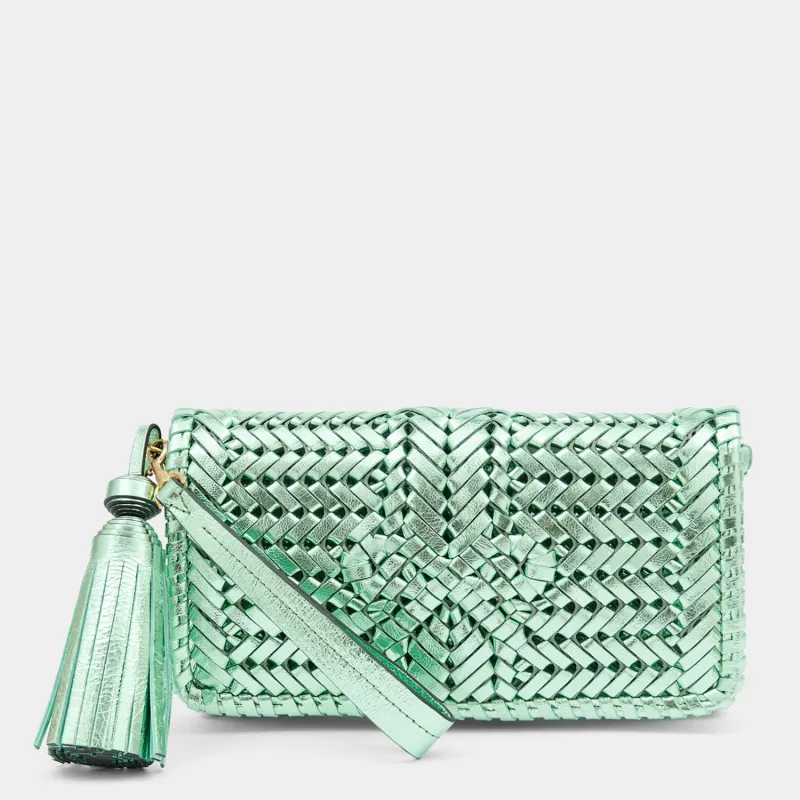 Neeson Tassel Clutch sold by Anya Hindmarch