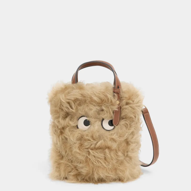 N/S Mini Eyes Shearling Tote sold by Anya Hindmarch