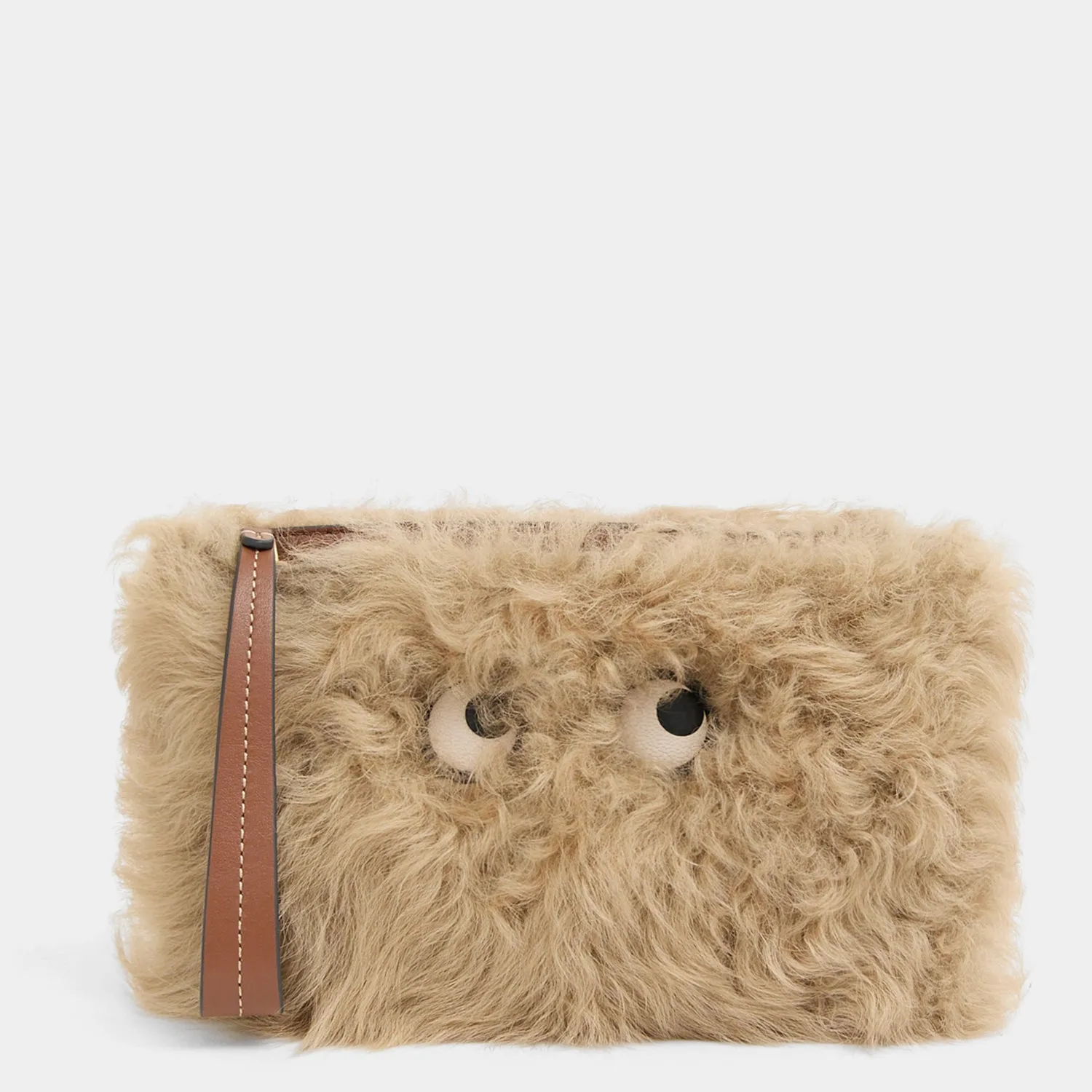 Shearling Eyes Clutch sold by Anya Hindmarch