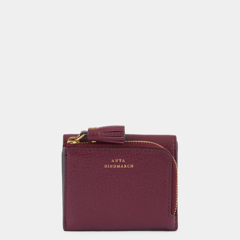 Peeping Eyes Mini Trifold Wallet sold by Anya Hindmarch