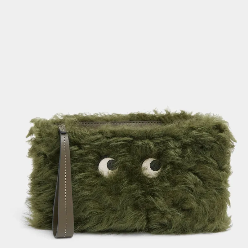 Shearling Eyes Clutch sold by Anya Hindmarch