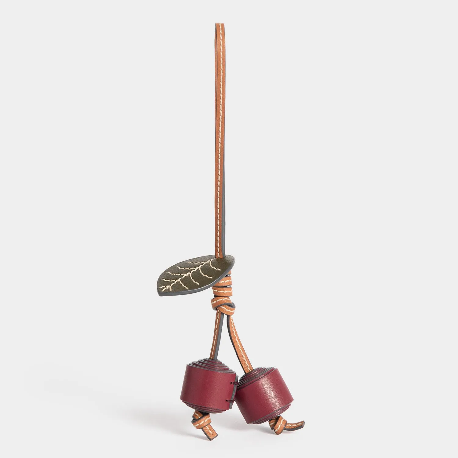 Return to Nature Cherry Charm sold by Anya Hindmarch