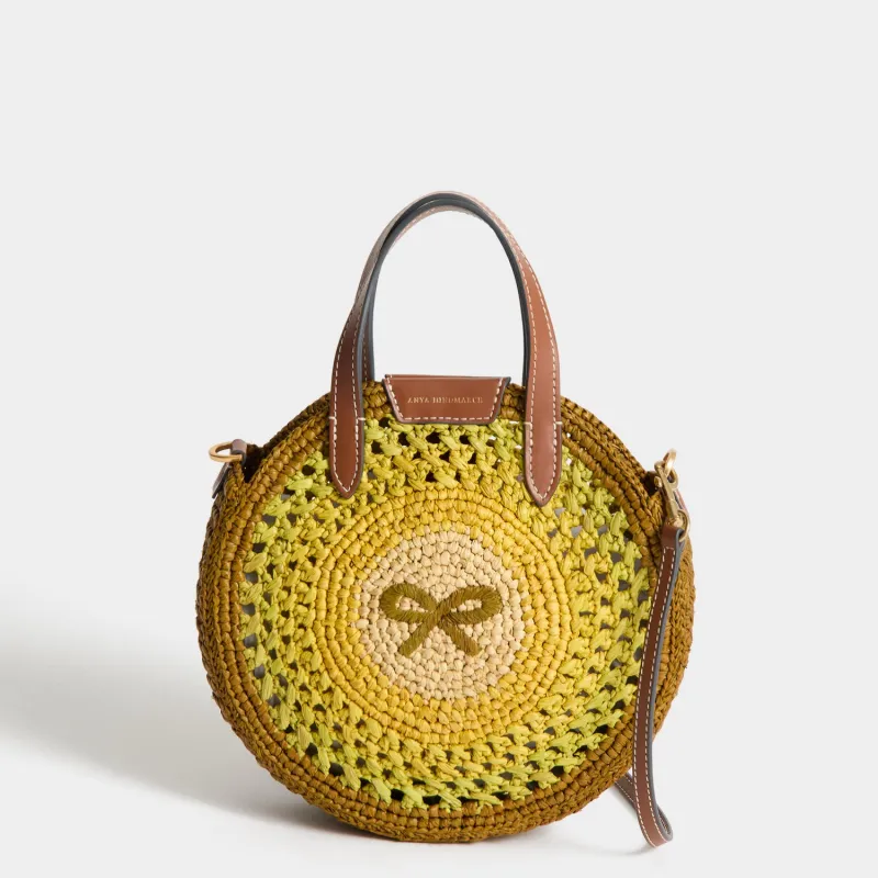 Raffia Small Round Bow Tote made by Anya Hindmarch