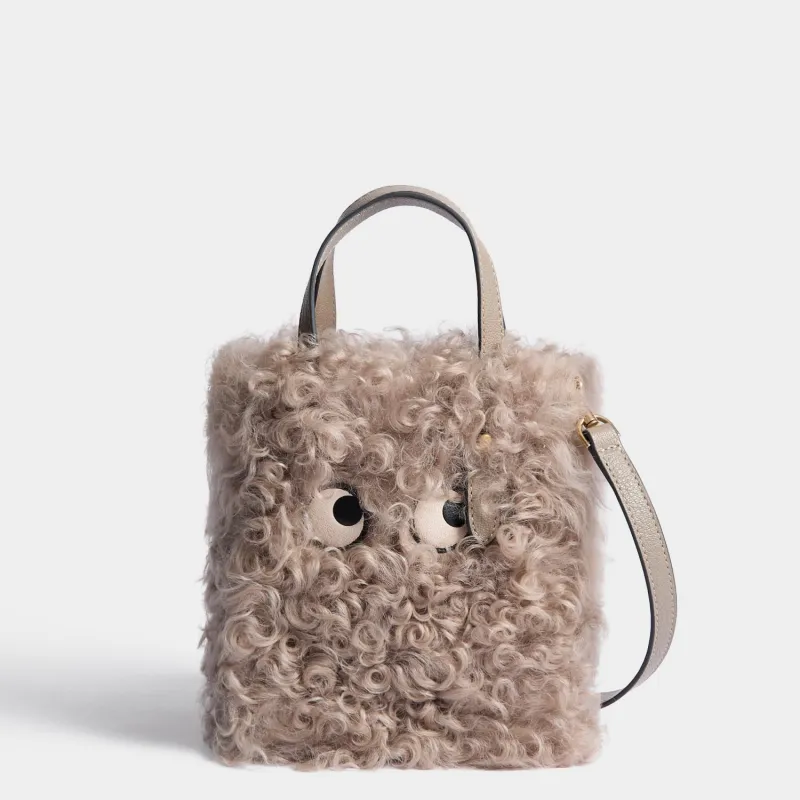 N/S Eyes Shearling Mini Tote made by Anya Hindmarch