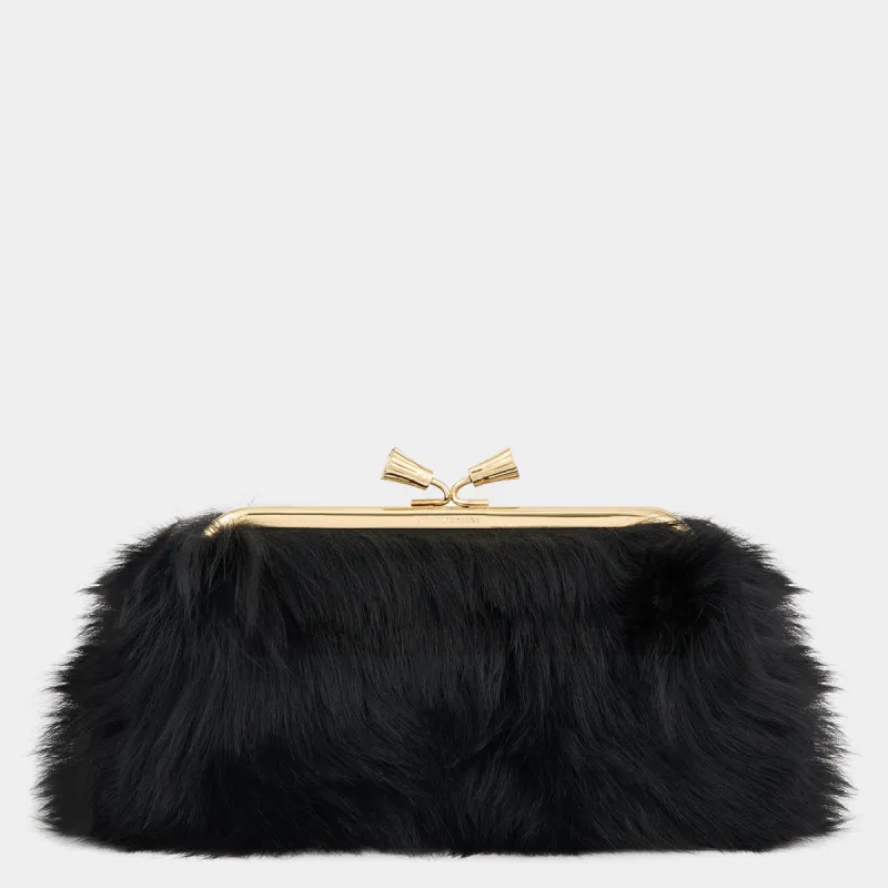 Maud Shearling Tassel Clutch sold by Anya Hindmarch