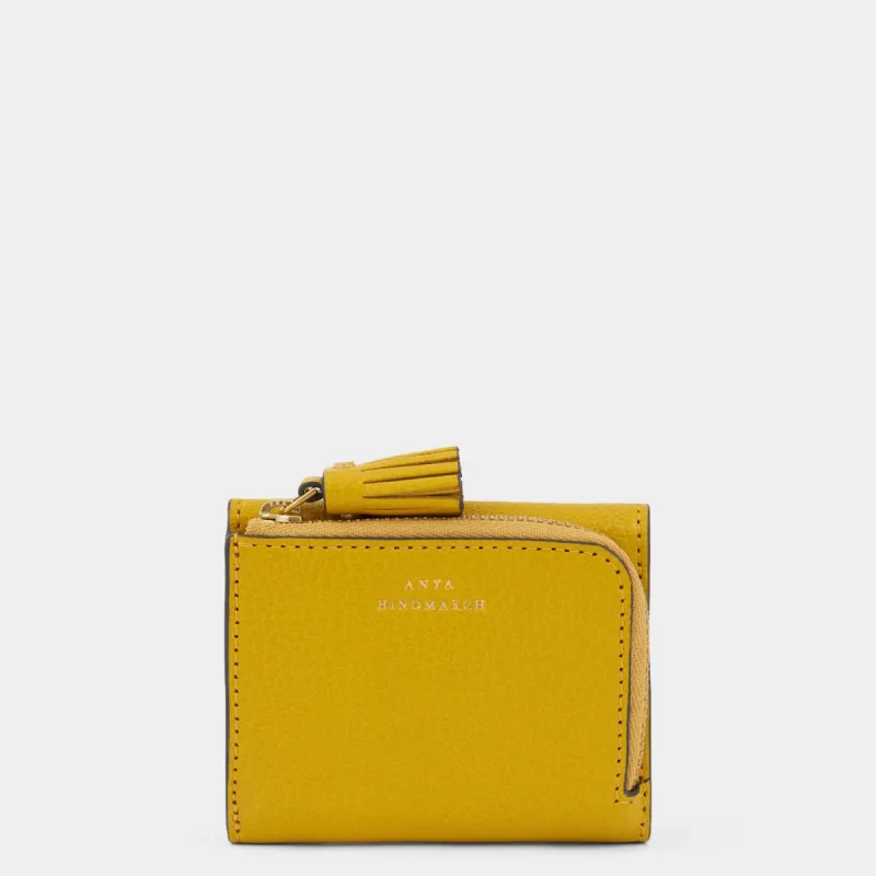 Peeping Eyes Mini Trifold Zip Wallet sold by Anya Hindmarch