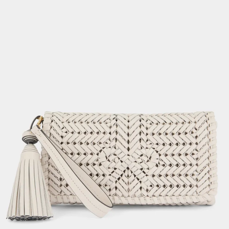 Neeson Tassel Clutch sold by Anya Hindmarch