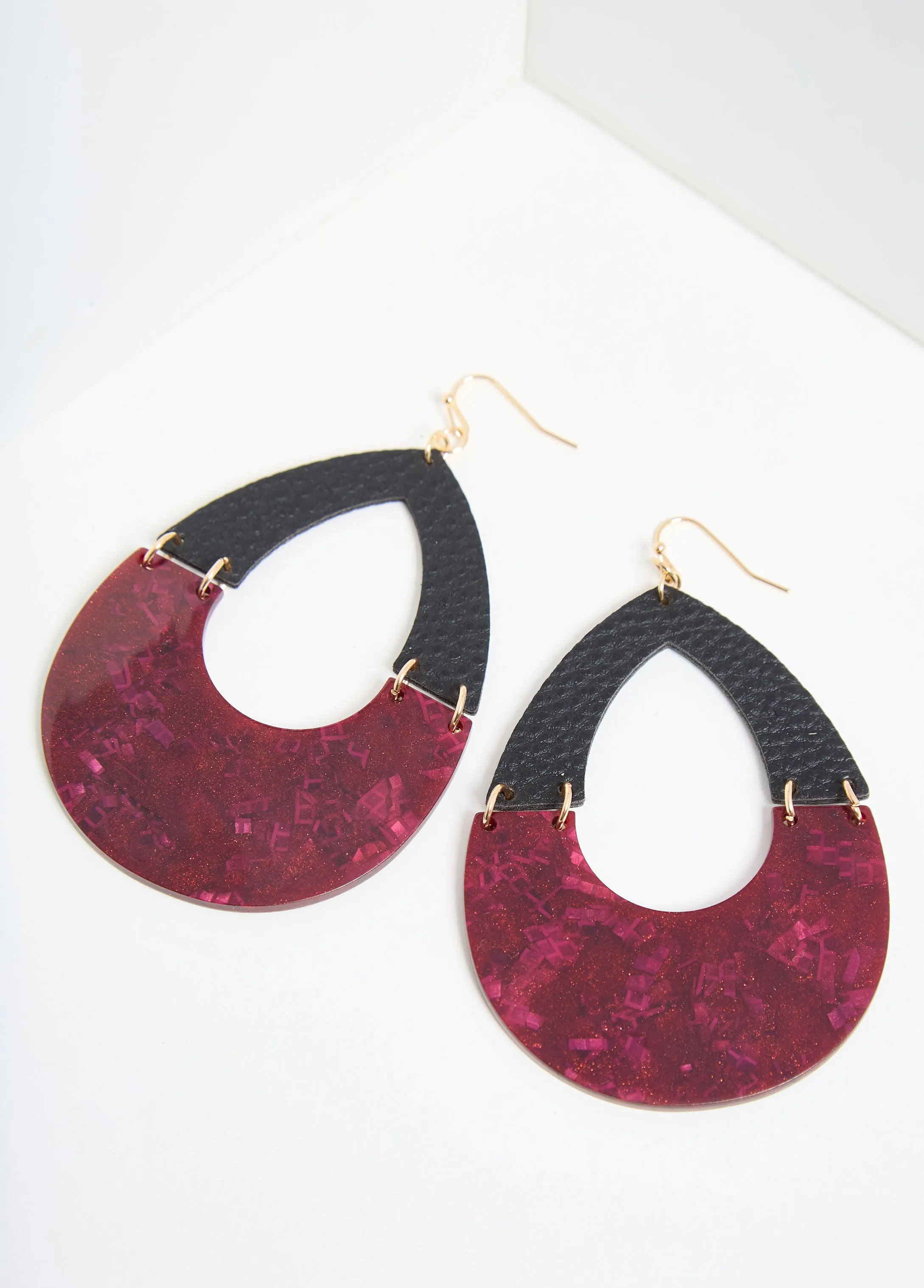 Glittered Faux Leather Earrings sold by Ashley Stewart