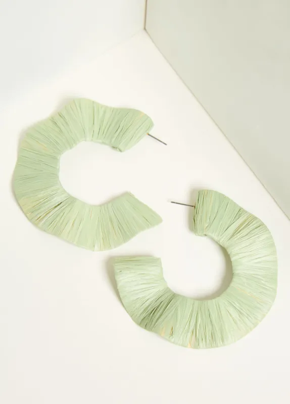 Wavy Raffia Hoop Earrings sold by Ashley Stewart