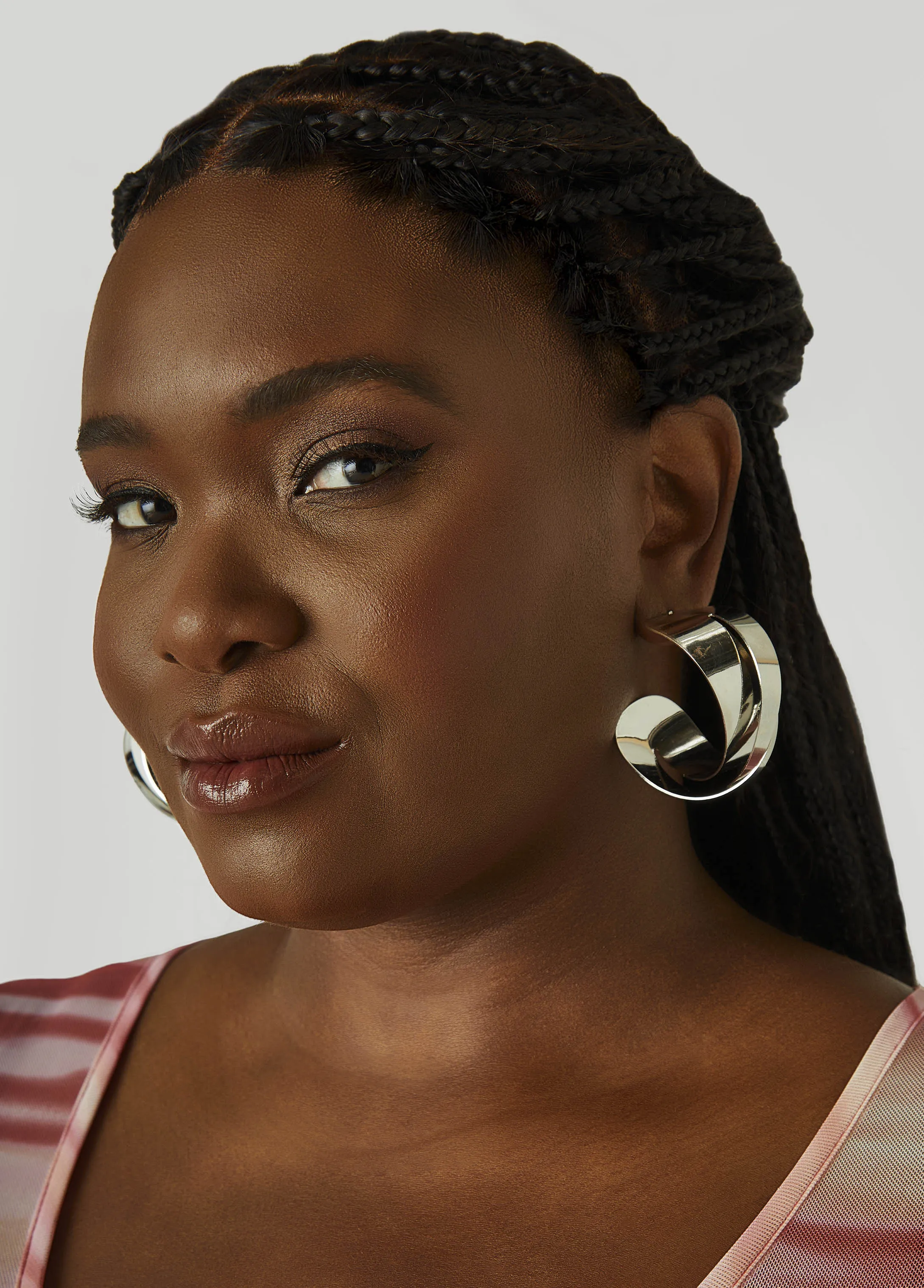 Twisted Silver Tone Hoop Earrings sold by Ashley Stewart