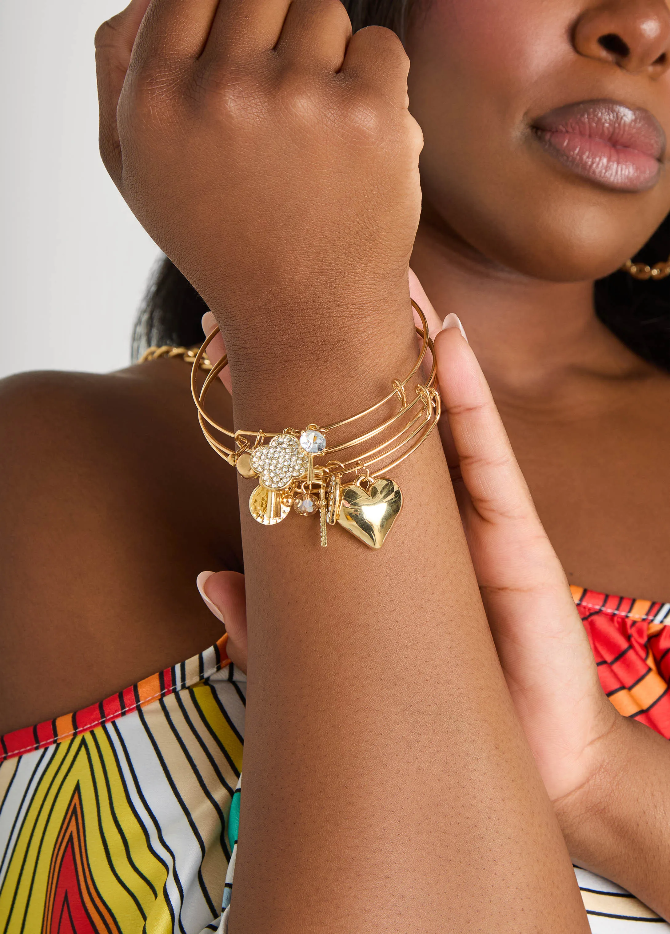 Set Of Three Charm Bangles sold by Ashley Stewart