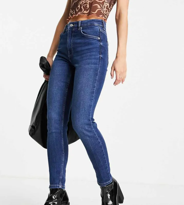Bershka Petite high waist skinny jean in dark blue sold by ASOS