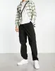 ASOS DESIGN tapered cargo trousers with toggles in black sold by ASOS