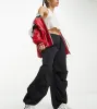 ASOS DESIGN Petite parachute cargo trouser in black sold by ASOS