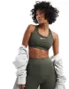 Nike Training Swoosh Dri-Fit medium support sports bra in khaki-Green sold by ASOS
