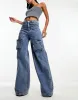 Simmi wide leg pocket detail jeans in blue wash sold by ASOS
