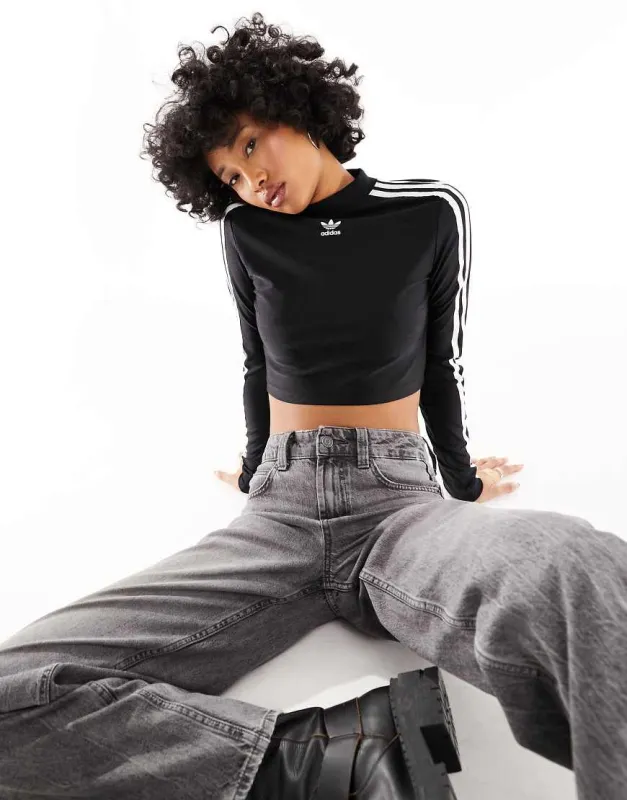 adidas Originals cropped long sleeve top in black sold by ASOS