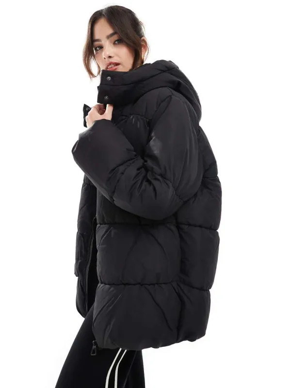 Vero Moda luxe oversized puffer coat in black sold by ASOS