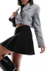 ASOS DESIGN pleated twill mini skirt in black sold by ASOS