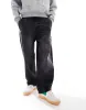 Pull&Bear skater fit washed jeans in black sold by ASOS