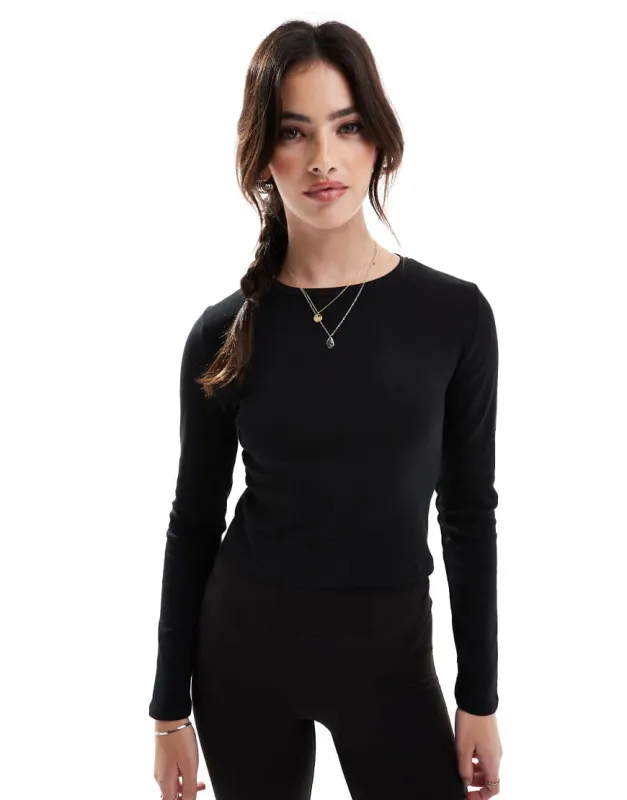 Stradivarius cotton long sleeve top in black made by ASOS