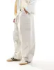 ASOS DESIGN parachute cargo trouser in cream-White sold by ASOS