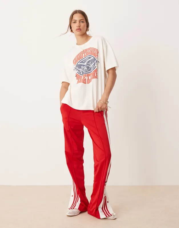 adidas Originals Adibreak track pants in red sold by ASOS