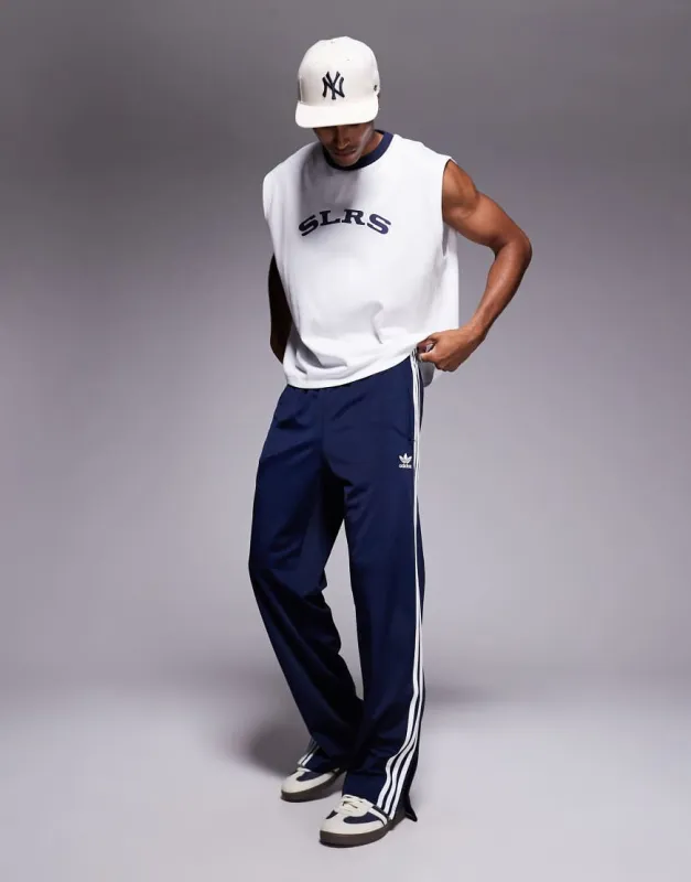 adidas Originals Firebird track pants in navy sold by ASOS