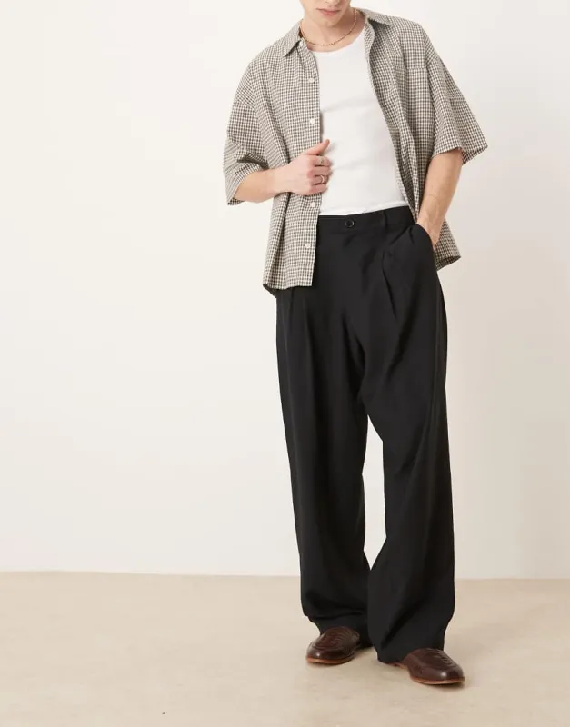 ASOS DESIGN wide leg smart pants with front pleat in black sold by ASOS