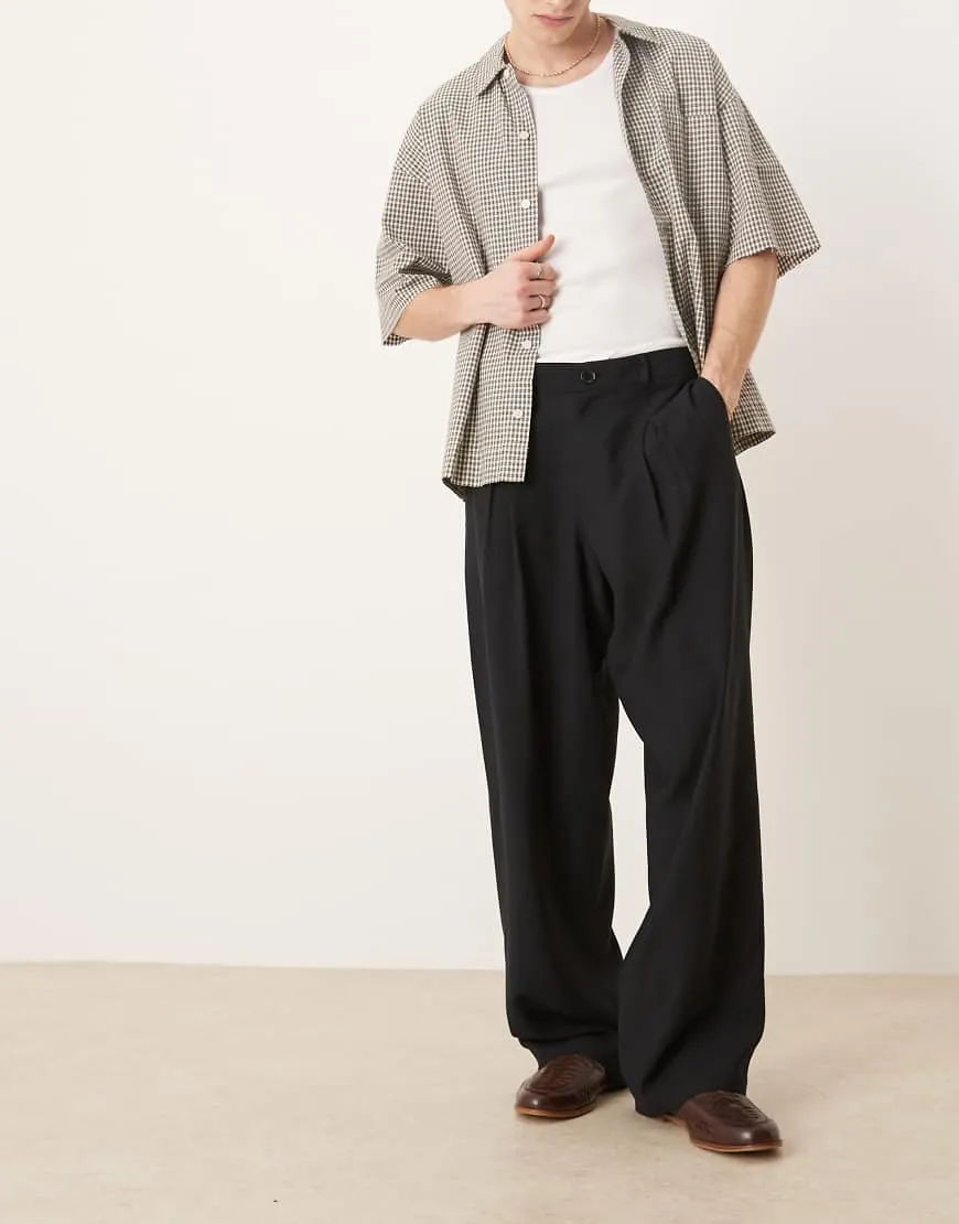 ASOS DESIGN wide leg smart pants with front pleat in black sold by ASOS