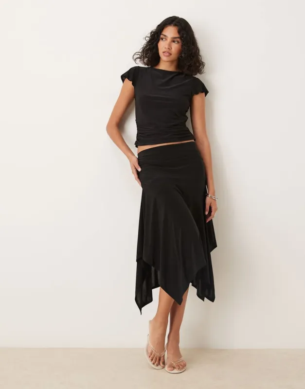 ASOS DESIGN co-ord slinky hanky hem skirt in black sold by ASOS
