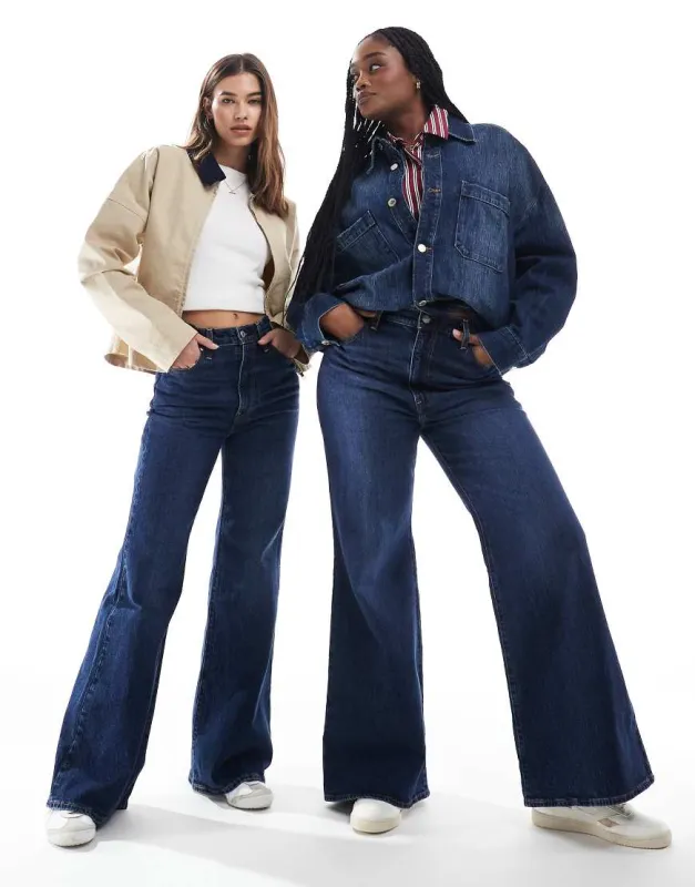 Levi's ribcage bells high rise flare jeans in mid blue sold by ASOS