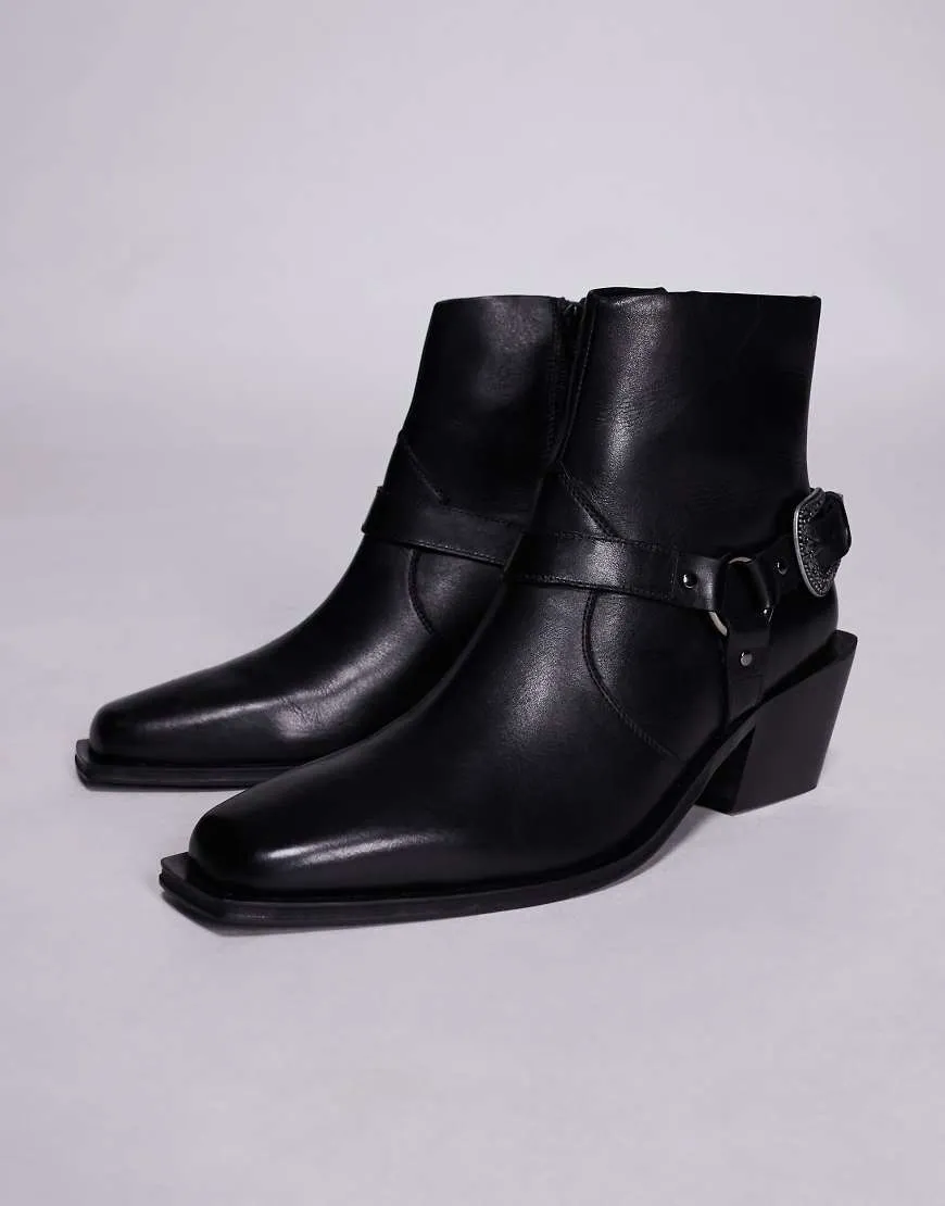ASOS DESIGN chelsea boots in black leather with buckle and cuban heel sold by ASOS
