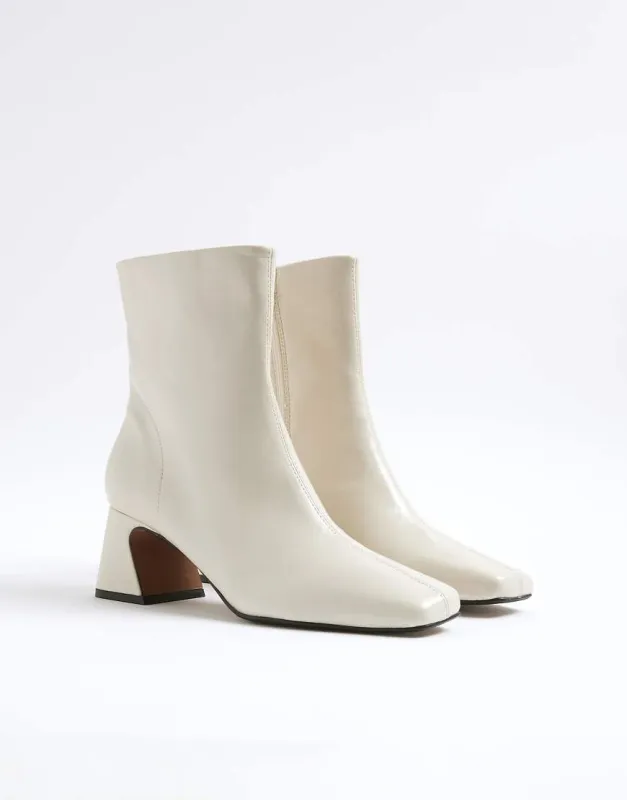 River Island Block heel ankle boots in cream-White sold by ASOS