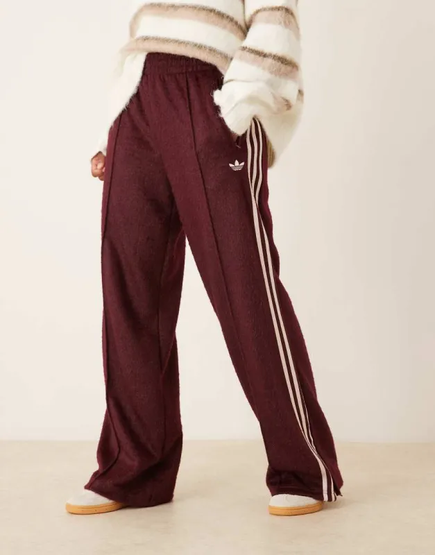 adidas Originals Firebird fluffy track pants in burgundy-Red sold by ASOS
