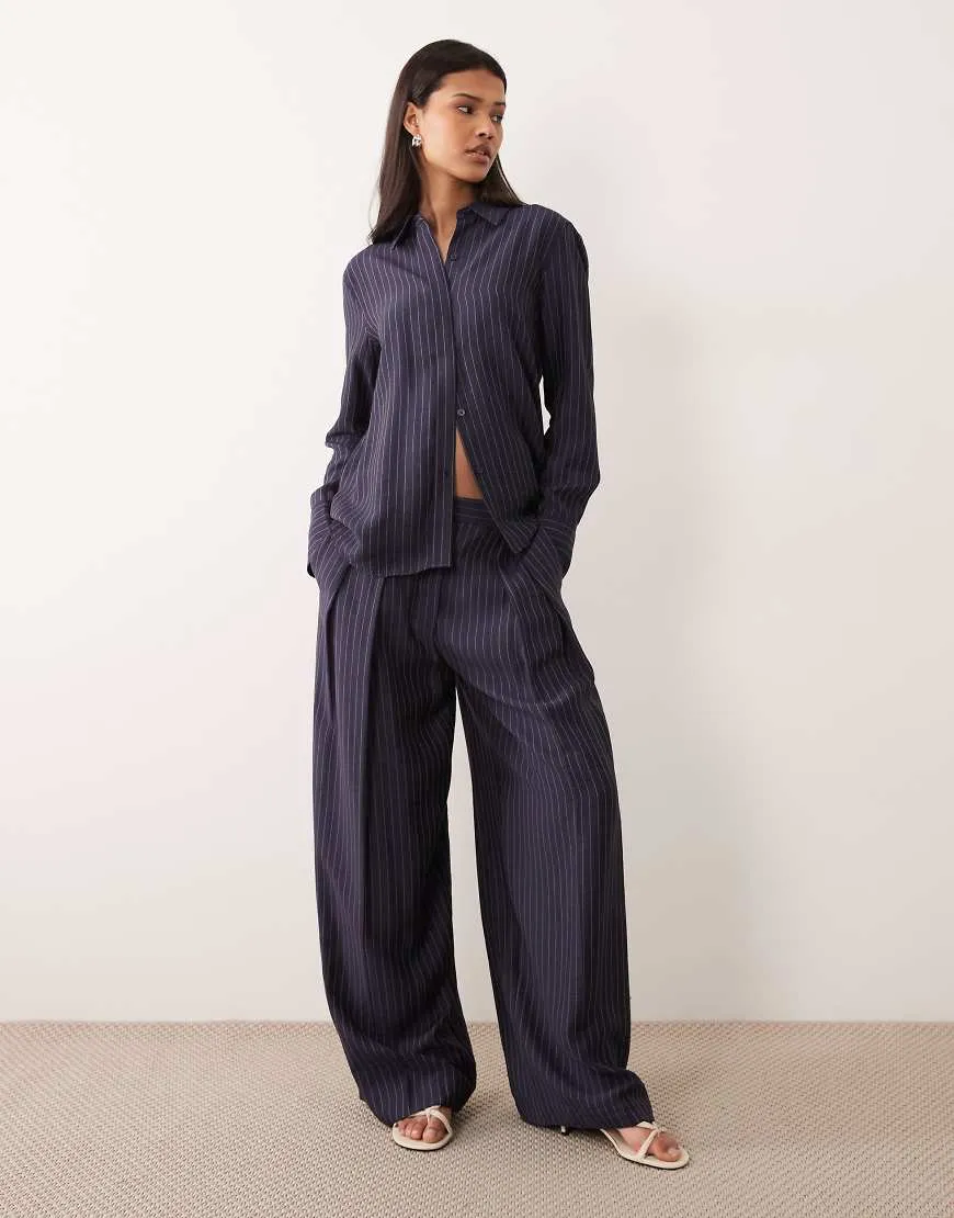 Mango Beli tailored wide leg trouser co-ord in navy pinstripe sold by ASOS