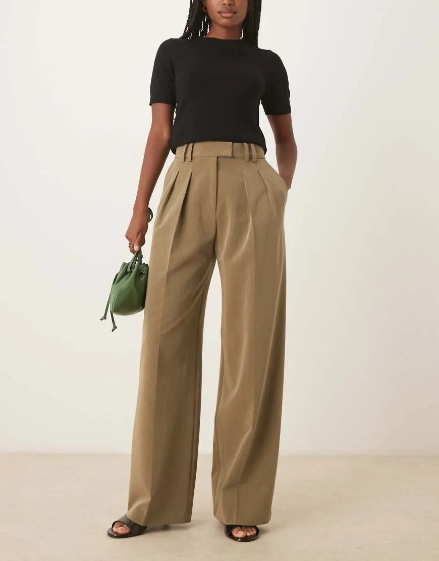 ASOS DESIGN tailored wide leg trousers with pleat detail in olive-Green sold by ASOS